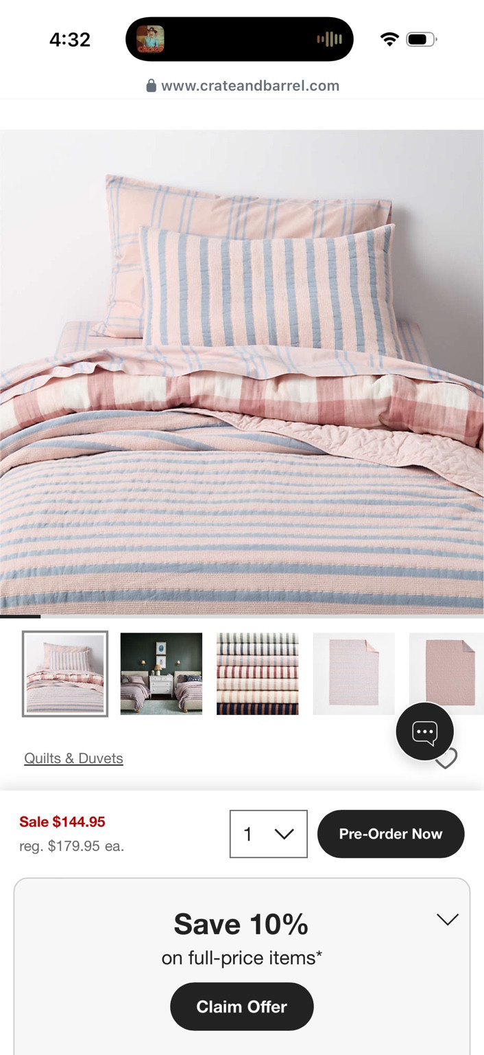 Pink and blue striped bedding and matching pillows in a product screenshot.